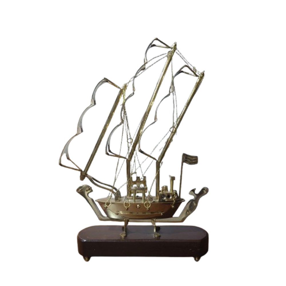 Brass crafted model of sailing ship with wooden base a showpiece for the showcase of livingroom